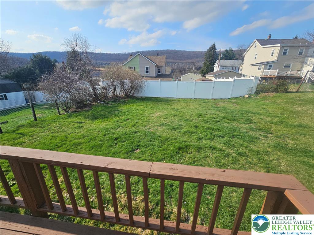 23 West Ruddle Street Coaldale, PA 18218 - Photo 13 of 16 a view of a big house with a big yard and large tree