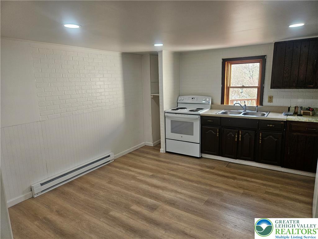 23 West Ruddle Street Coaldale, PA 18218 - Photo 4 of 16 a view of kitchen with granite countertop cabinets a sink and dishwasher