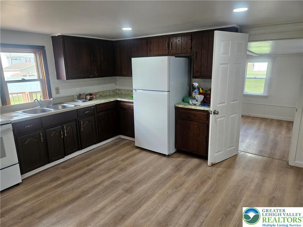 23 West Ruddle Street Coaldale, PA 18218 - Photo 5 of 16 a kitchen with stainless steel appliances granite countertop a refrigerator a sink and a stove