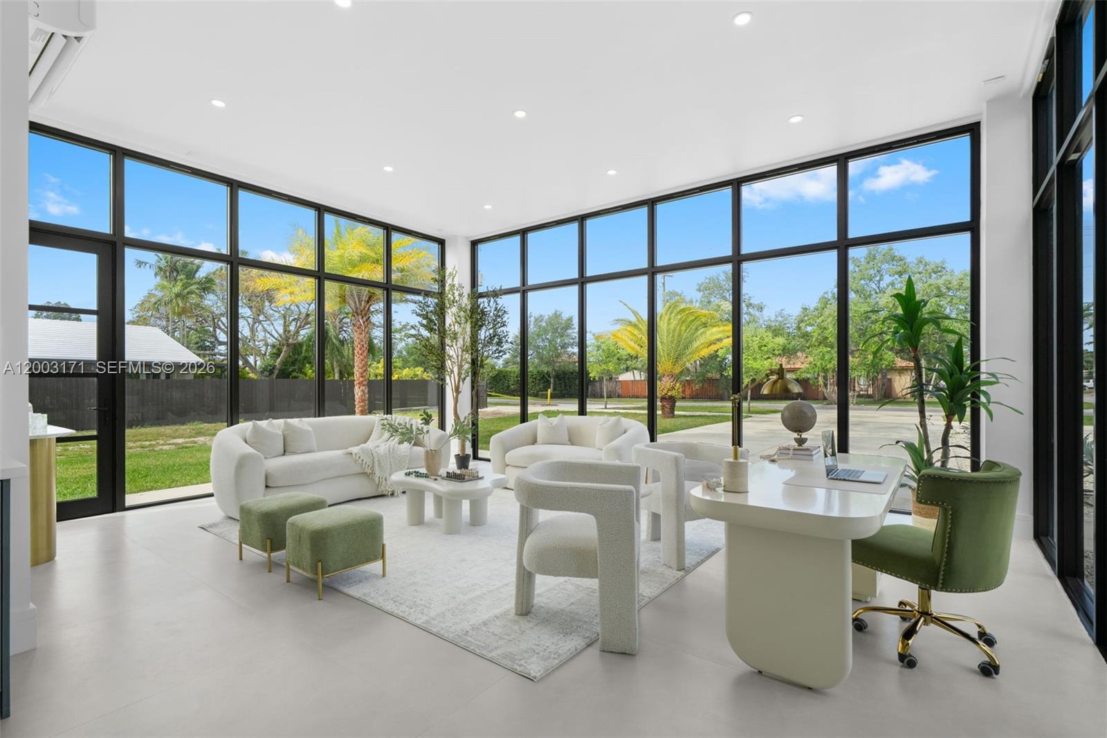 29705 Southwest 187th Avenue Homestead, FL 33030 - Photo 15 of 55 a living room with furniture and floor to ceiling windows