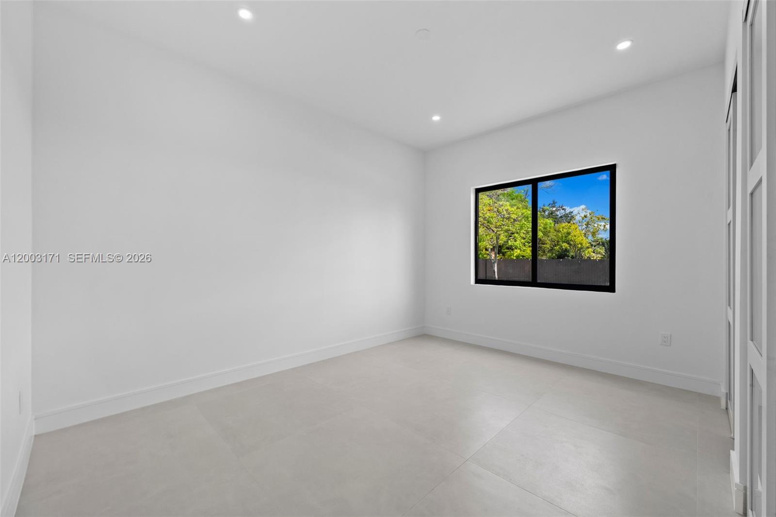 29705 Southwest 187th Avenue Homestead, FL 33030 - Photo 23 of 55 an empty room with windows