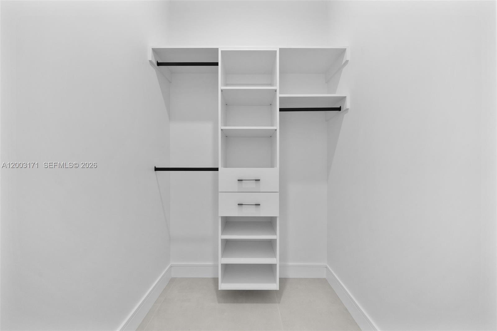 29705 Southwest 187th Avenue Homestead, FL 33030 - Photo 31 of 55 a view of an empty walk in closet