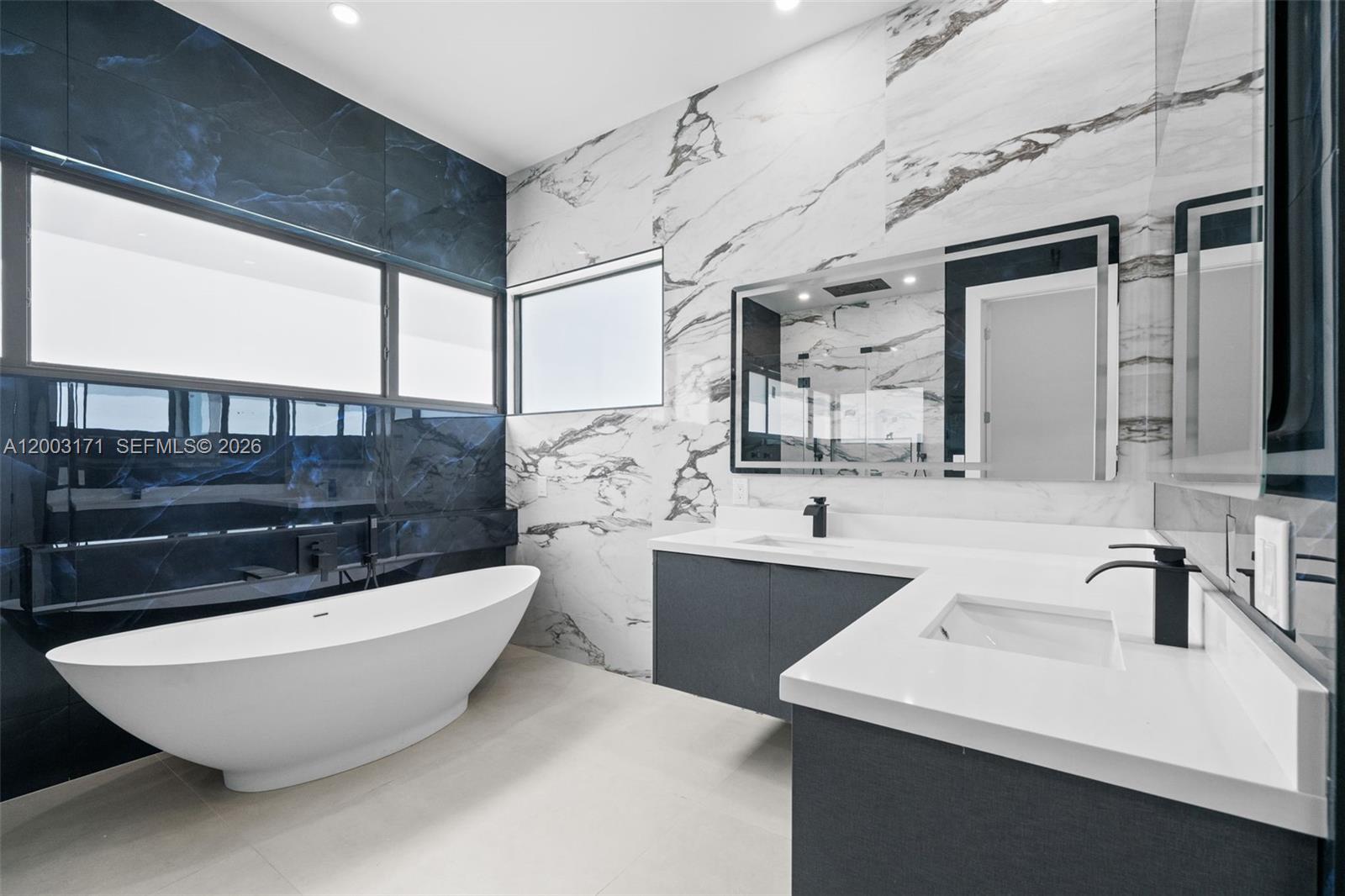 29705 Southwest 187th Avenue Homestead, FL 33030 - Photo 33 of 55 a bathroom with a bathtub and a sink