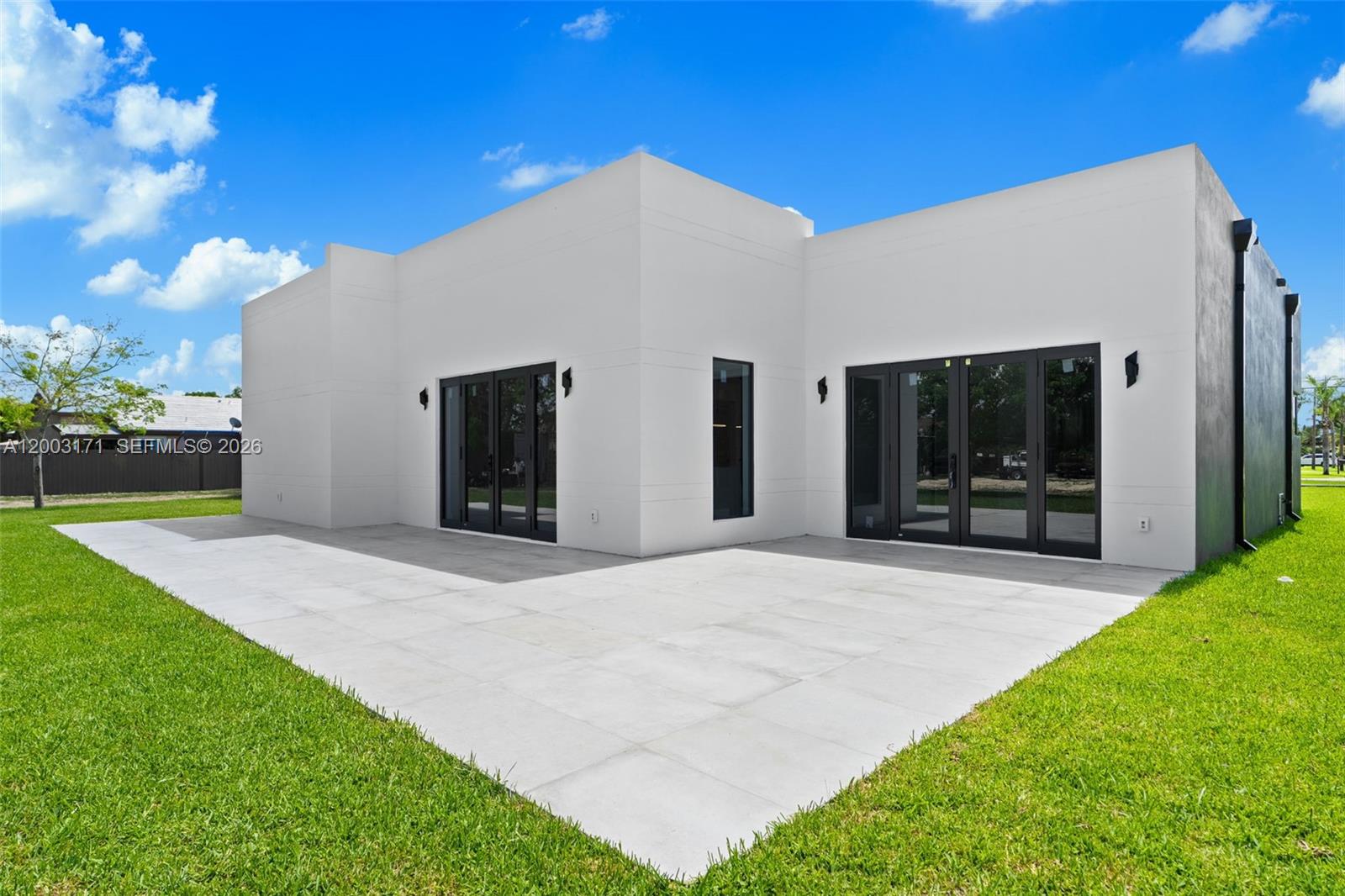 29705 Southwest 187th Avenue Homestead, FL 33030 - Photo 40 of 55 a front view of house with yard