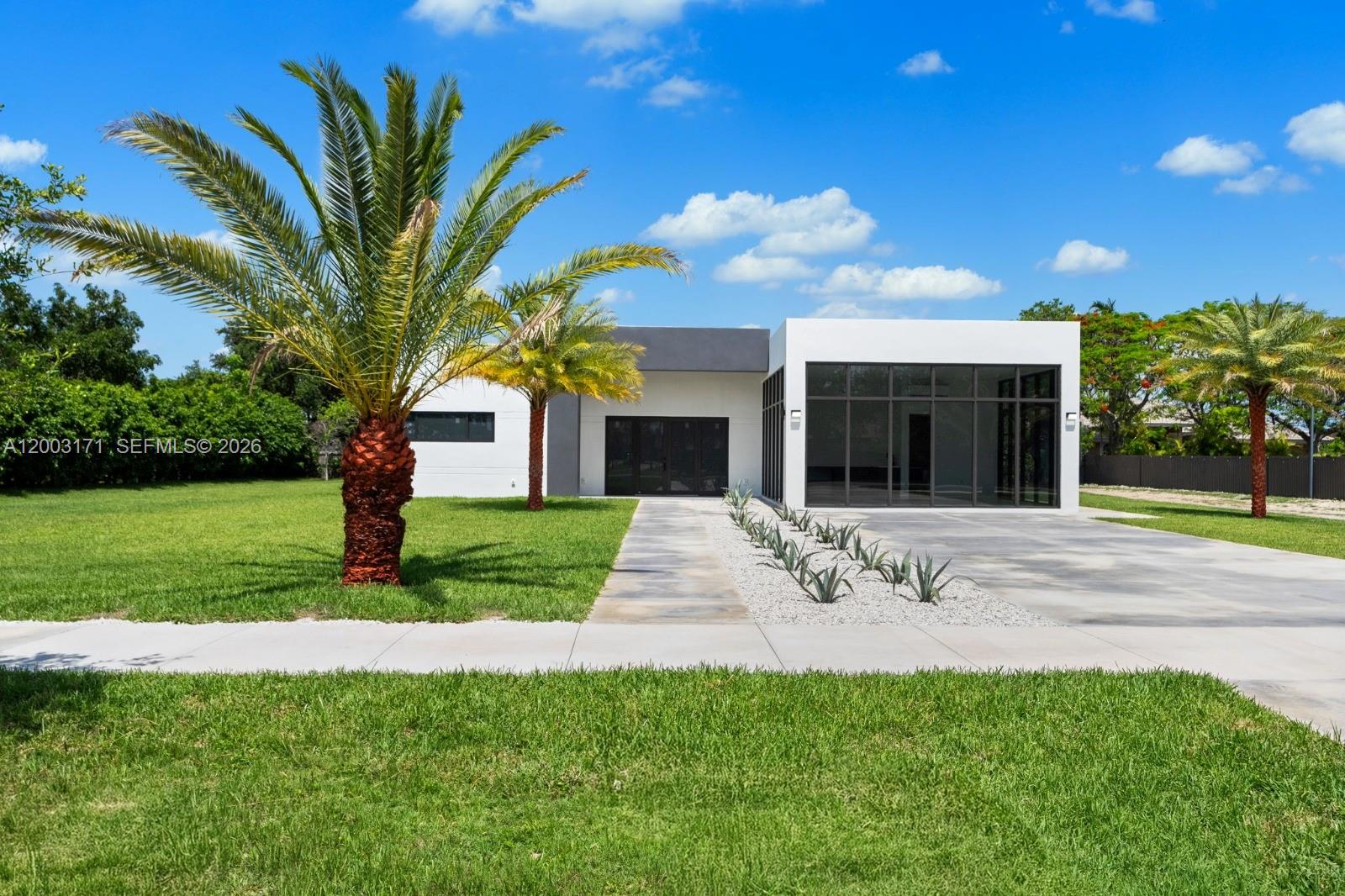 29705 Southwest 187th Avenue Homestead, FL 33030 - Photo 43 of 55 a view of a house with a yard and tree s