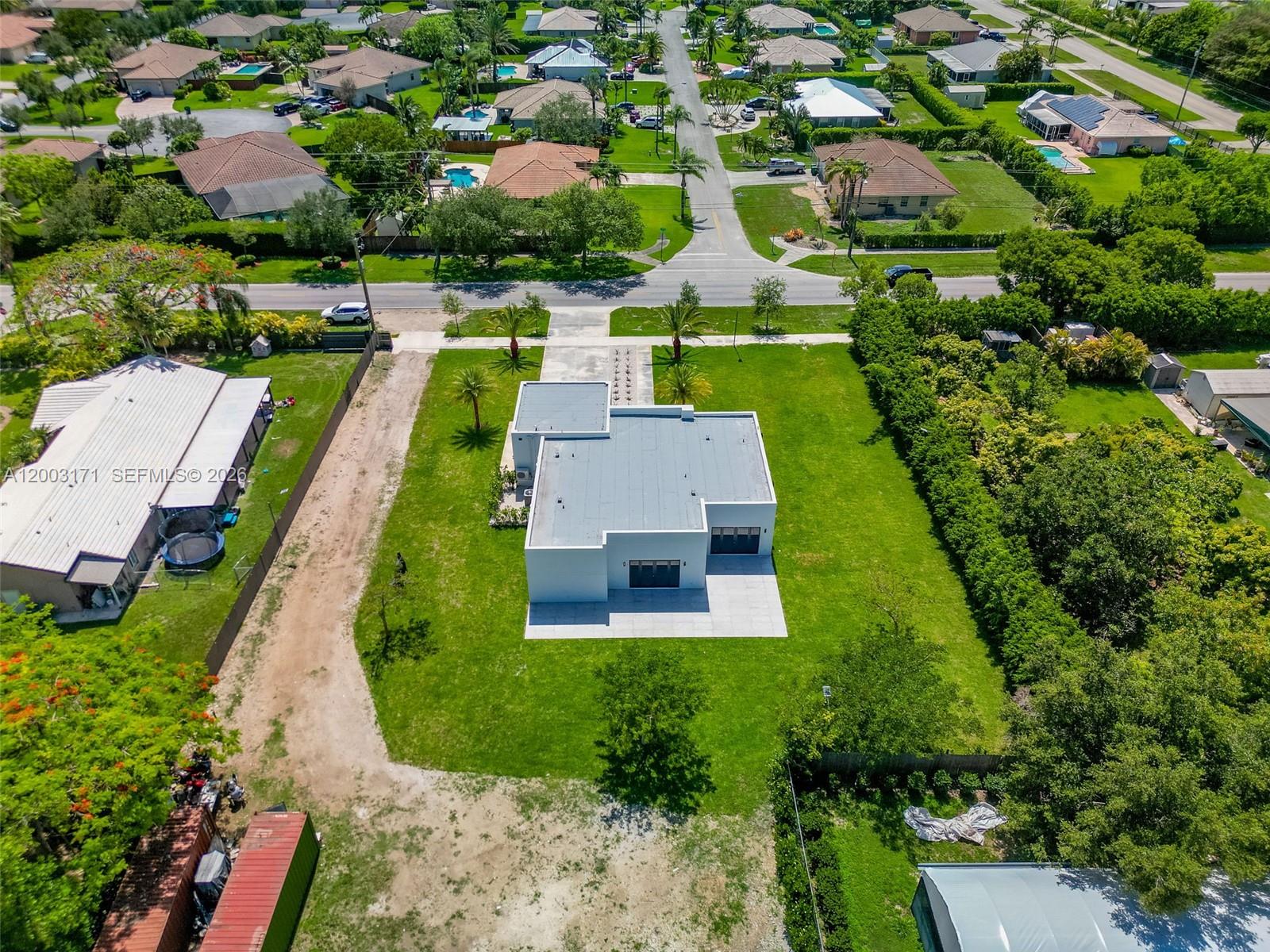 29705 Southwest 187th Avenue Homestead, FL 33030 - Photo 44 of 55 an aerial view of a house with yard swimming pool and outdoor seating