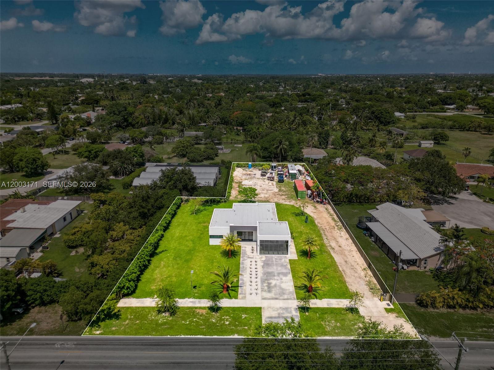 29705 Southwest 187th Avenue Homestead, FL 33030 - Photo 47 of 55 an aerial view of house with yard swimming pool and outdoor seating