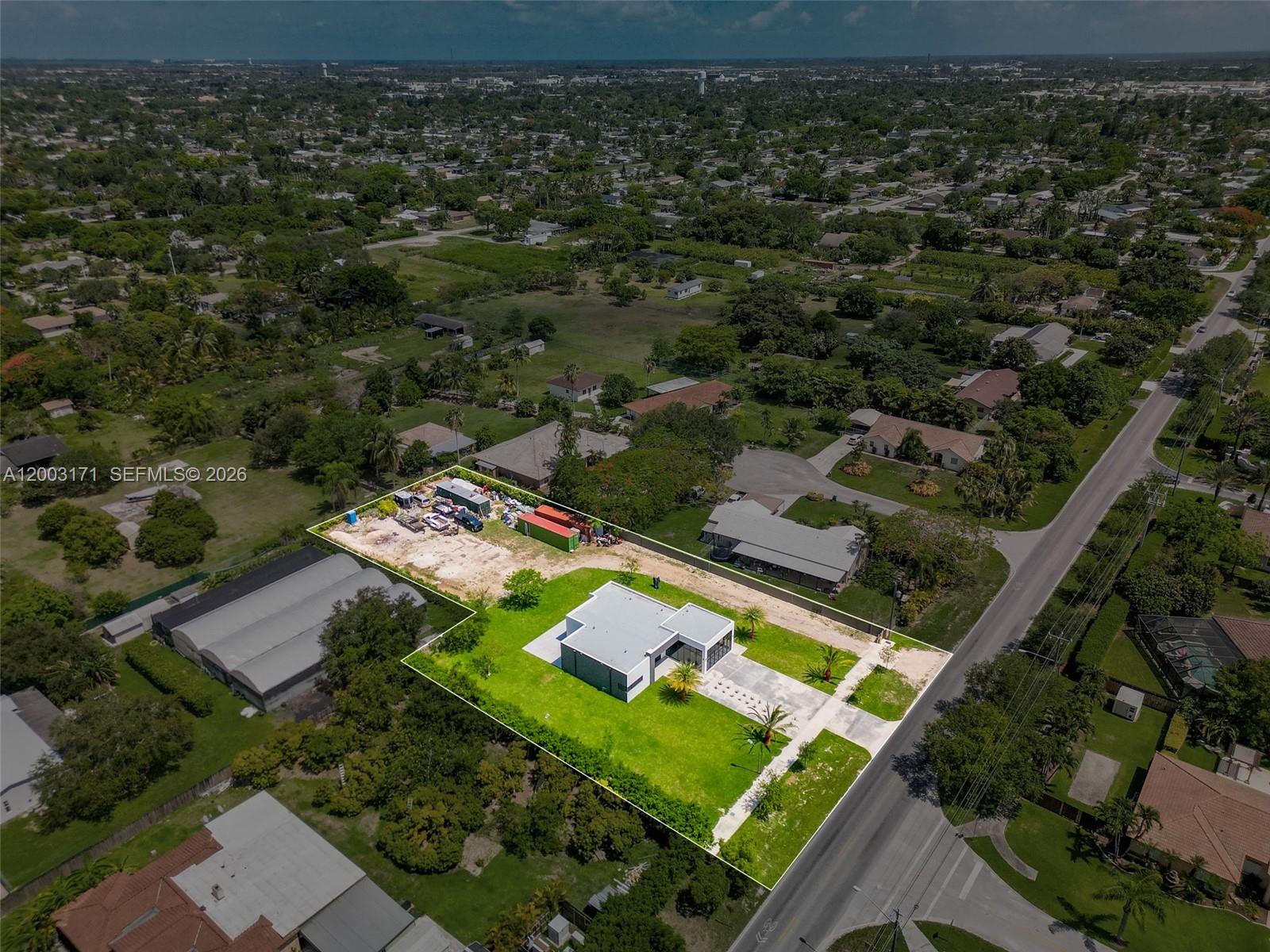 29705 Southwest 187th Avenue Homestead, FL 33030 - Photo 48 of 55 an aerial view of residential houses with outdoor space