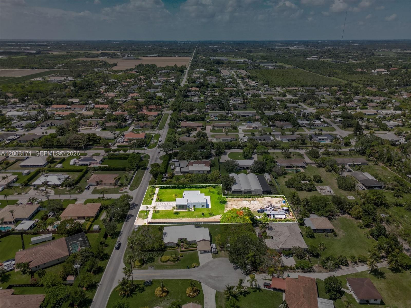 29705 Southwest 187th Avenue Homestead, FL 33030 - Photo 49 of 55 an aerial view of residential houses with outdoor space