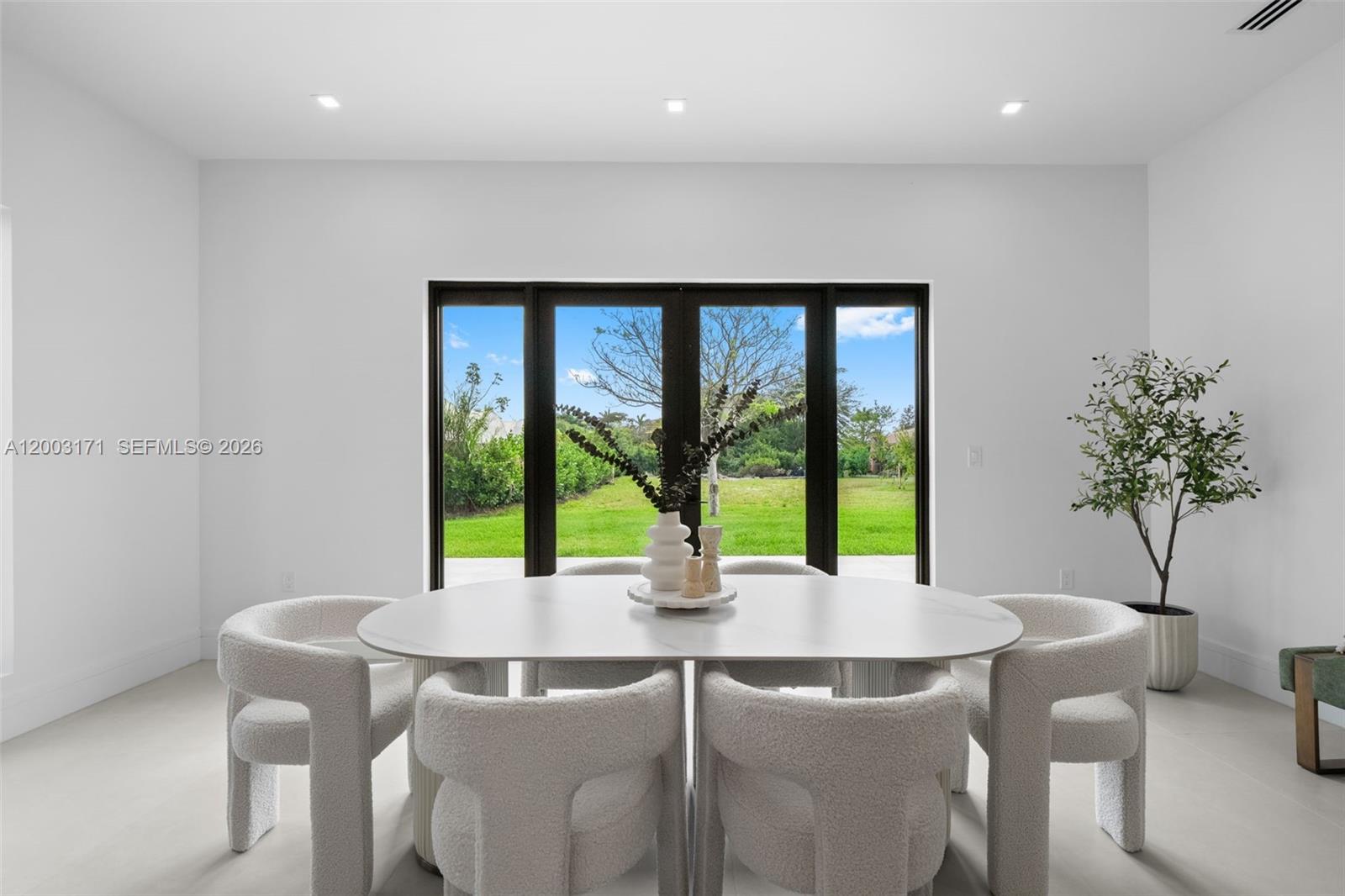 29705 Southwest 187th Avenue Homestead, FL 33030 - Photo 8 of 55 a dining room with furniture and window