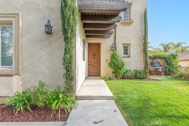 a backyard of a house with outdoor seating