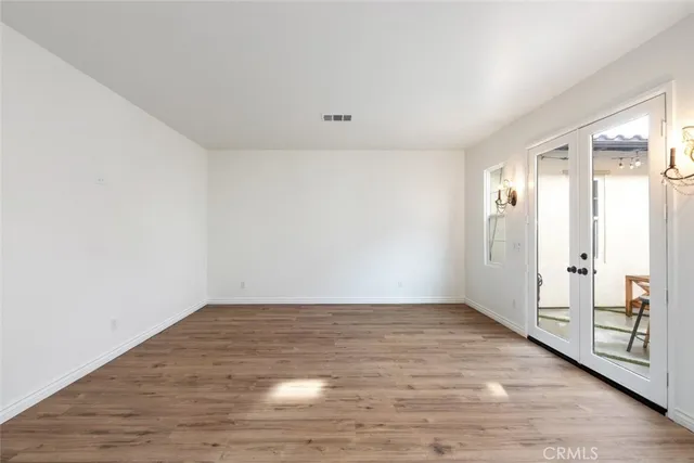 a view of kitchen with stainless steel appliances granite countertop a sink and a refrigerator