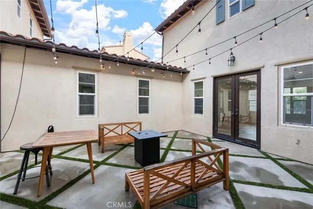 a view of a big room with wooden floor and a ceiling fan