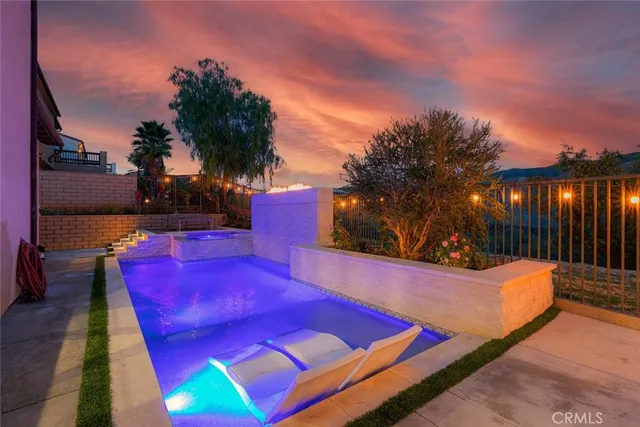 a view of a house with a bed in a patio