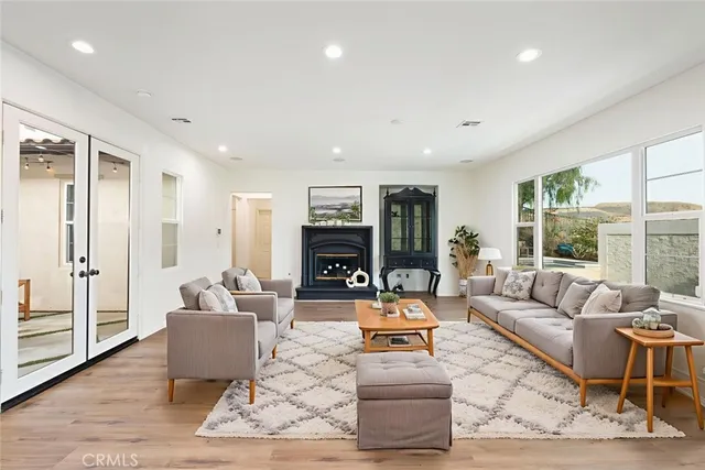 a bedroom with a large bed and a couch