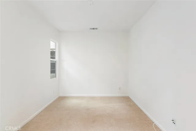 a spacious bathroom with a sink a toilet and mirror