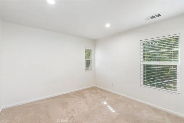 a front view of a house with outdoor seating