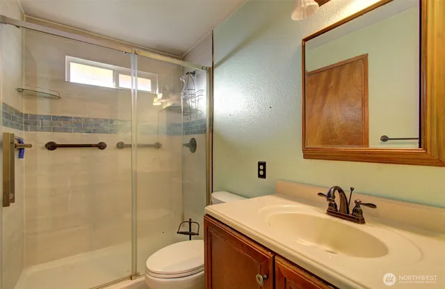 a bathroom with a shower and a toilet