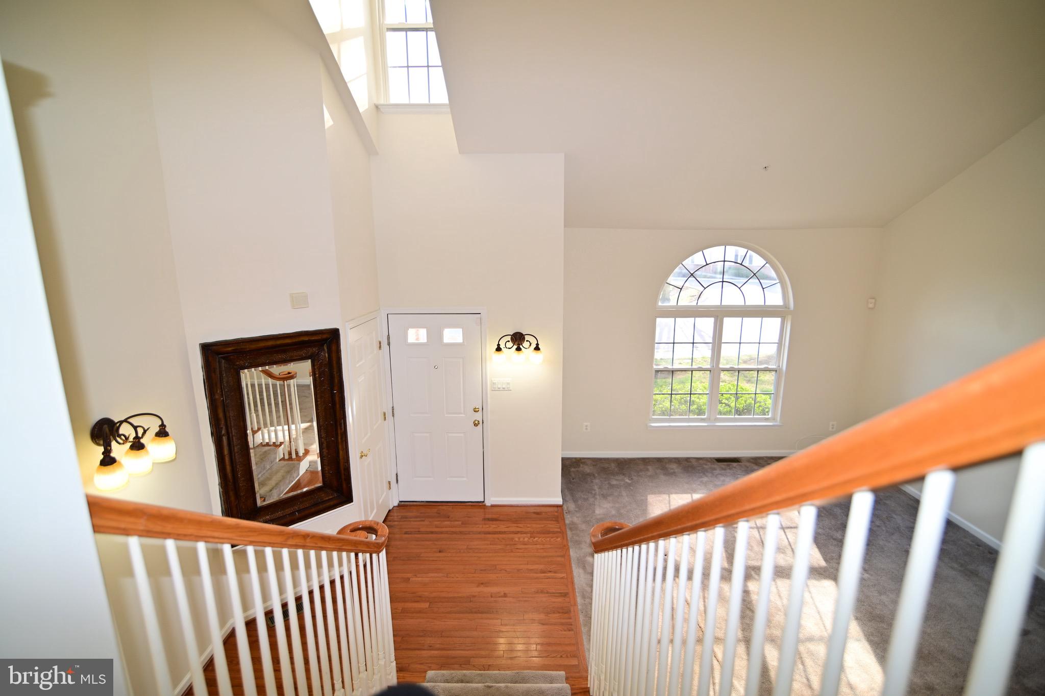 9802 Hillandale Way, Unit 23 Bowie, MD 20721 - Photo 4 of 28 Foyer View from Upper Level / Cathedral Ceilings