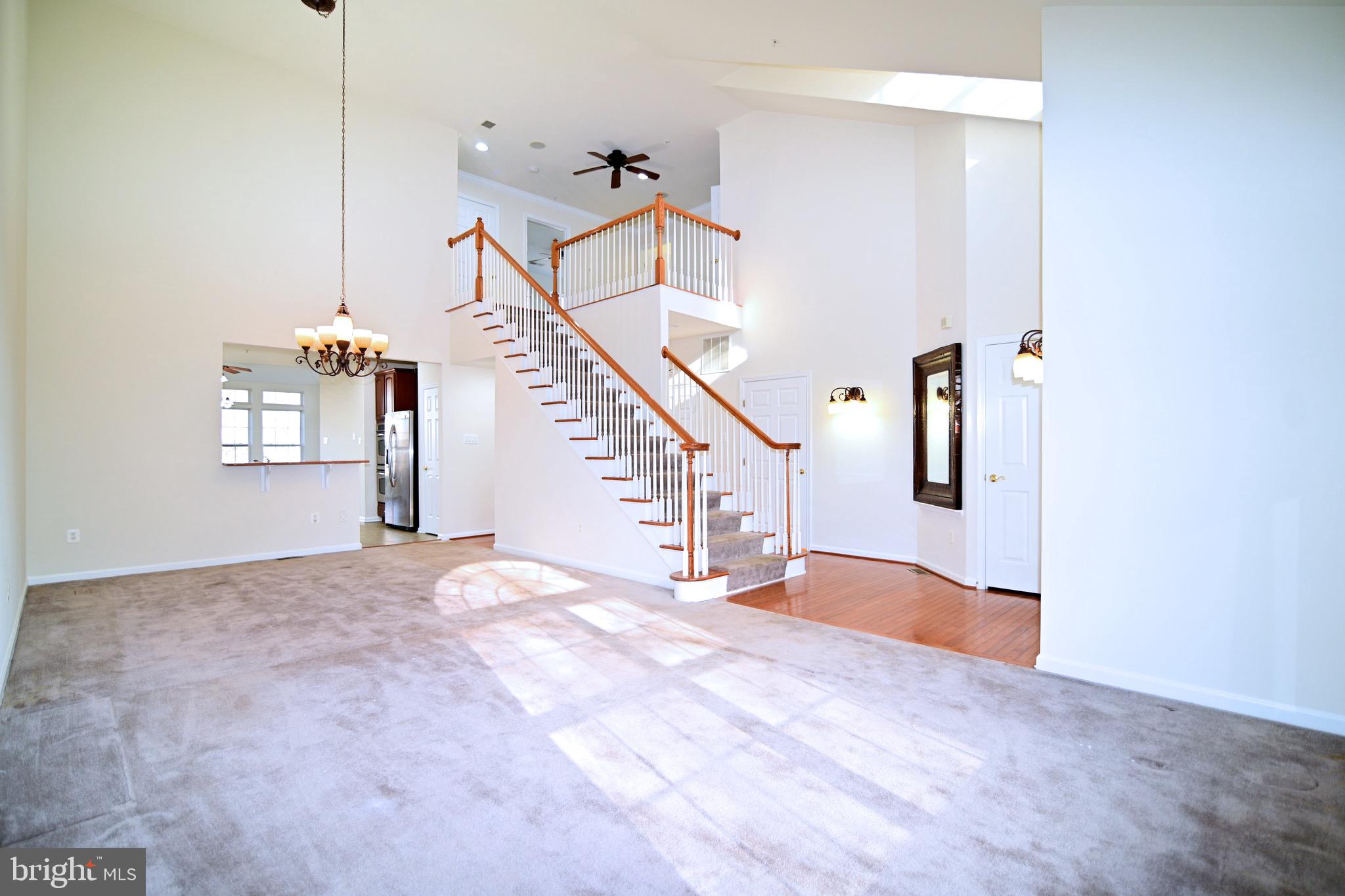 9802 Hillandale Way, Unit 23 Bowie, MD 20721 - Photo 5 of 28 Living Room / Dining Room / Staircase