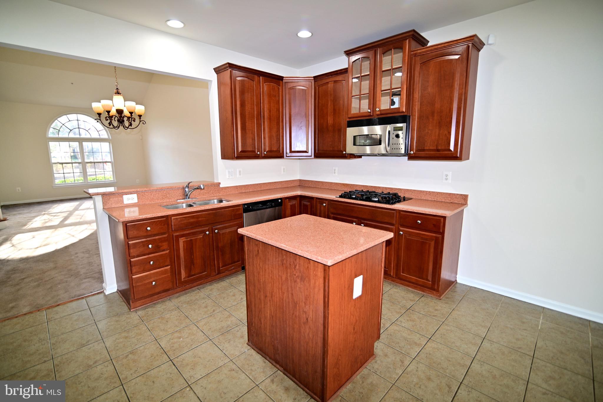9802 Hillandale Way, Unit 23 Bowie, MD 20721 - Photo 9 of 28 Cooktop / Microwave / Island