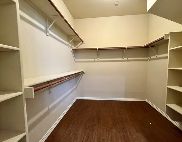 a view of an empty walk in closet