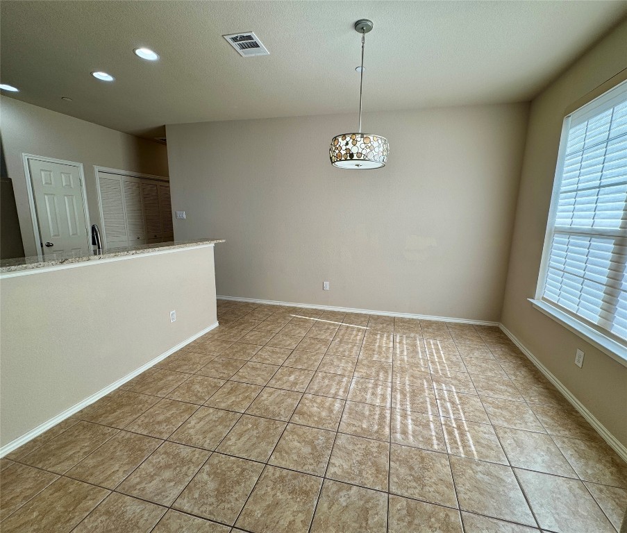 3101 Davis Lane, Unit 8703 Austin, TX 78748 - Photo 5 of 23 a view of empty room with wooden floor and window