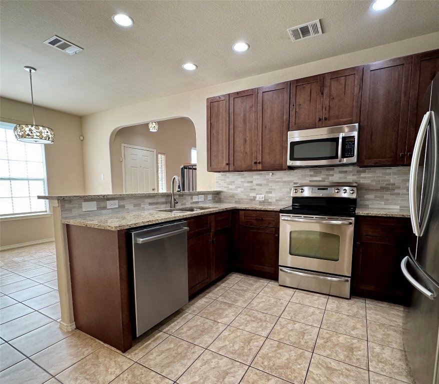 3101 Davis Lane, Unit 8703 Austin, TX 78748 - Photo 7 of 23 a kitchen with sink a microwave and cabinets