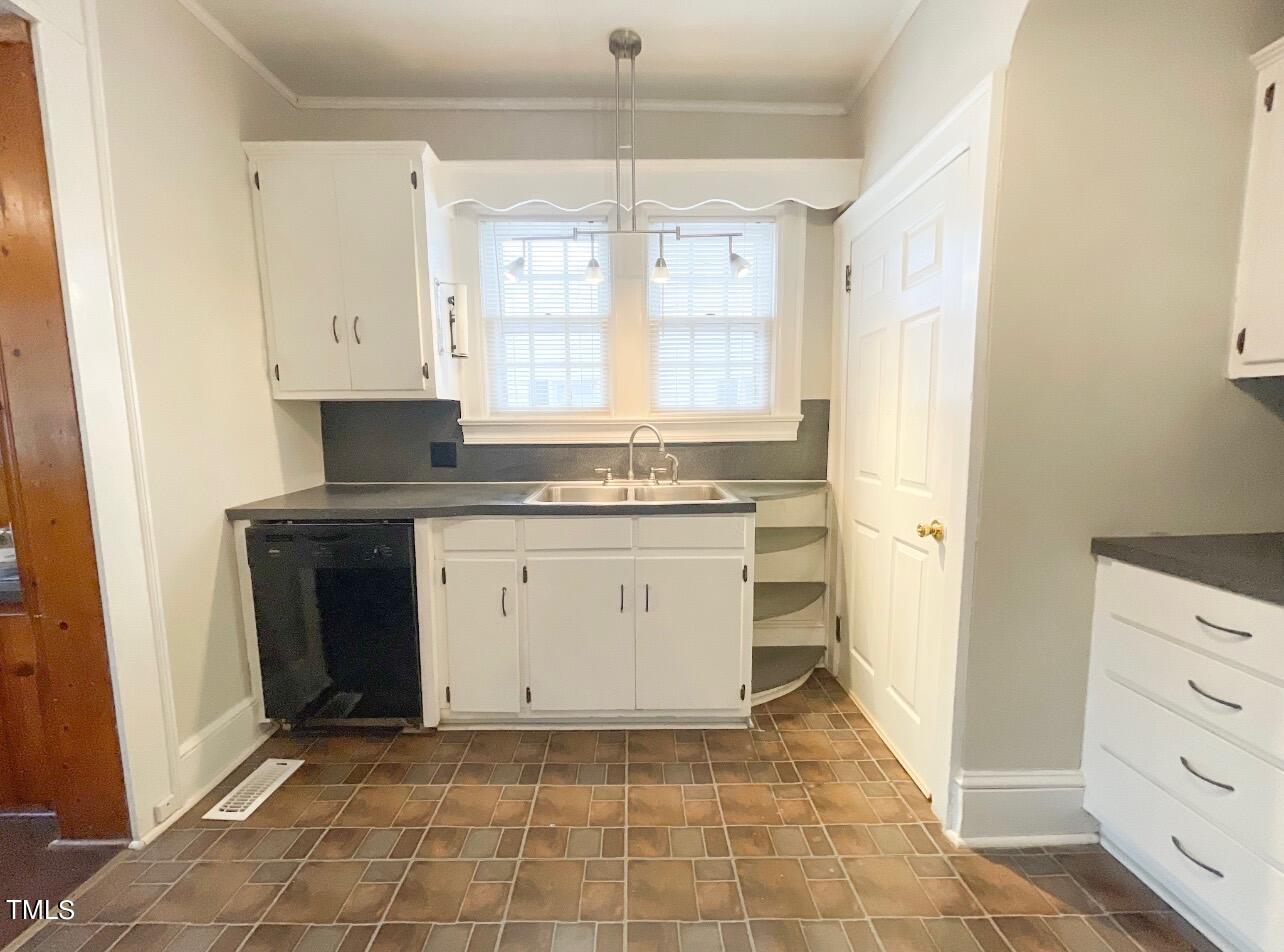 237 Wesleyan Heights Road Roxboro, NC 27573 - Photo 13 of 39 a view of a kitchen with stove