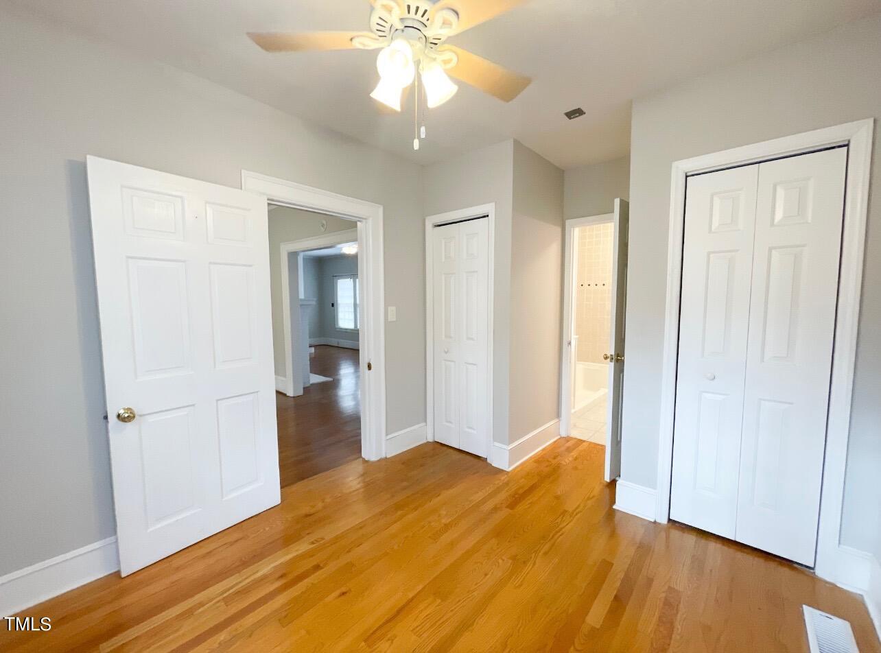 237 Wesleyan Heights Road Roxboro, NC 27573 - Photo 16 of 39 a view of livingroom with hardwood floor and a ceiling fan