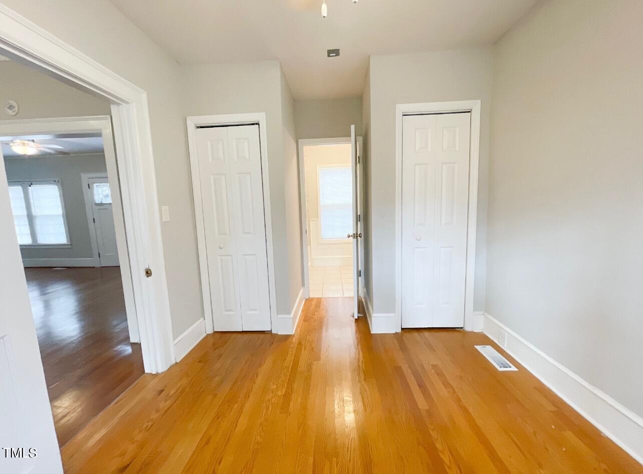 237 Wesleyan Heights Road Roxboro, NC 27573 - Photo 18 of 39 a view of a room with wooden floor and brick wall