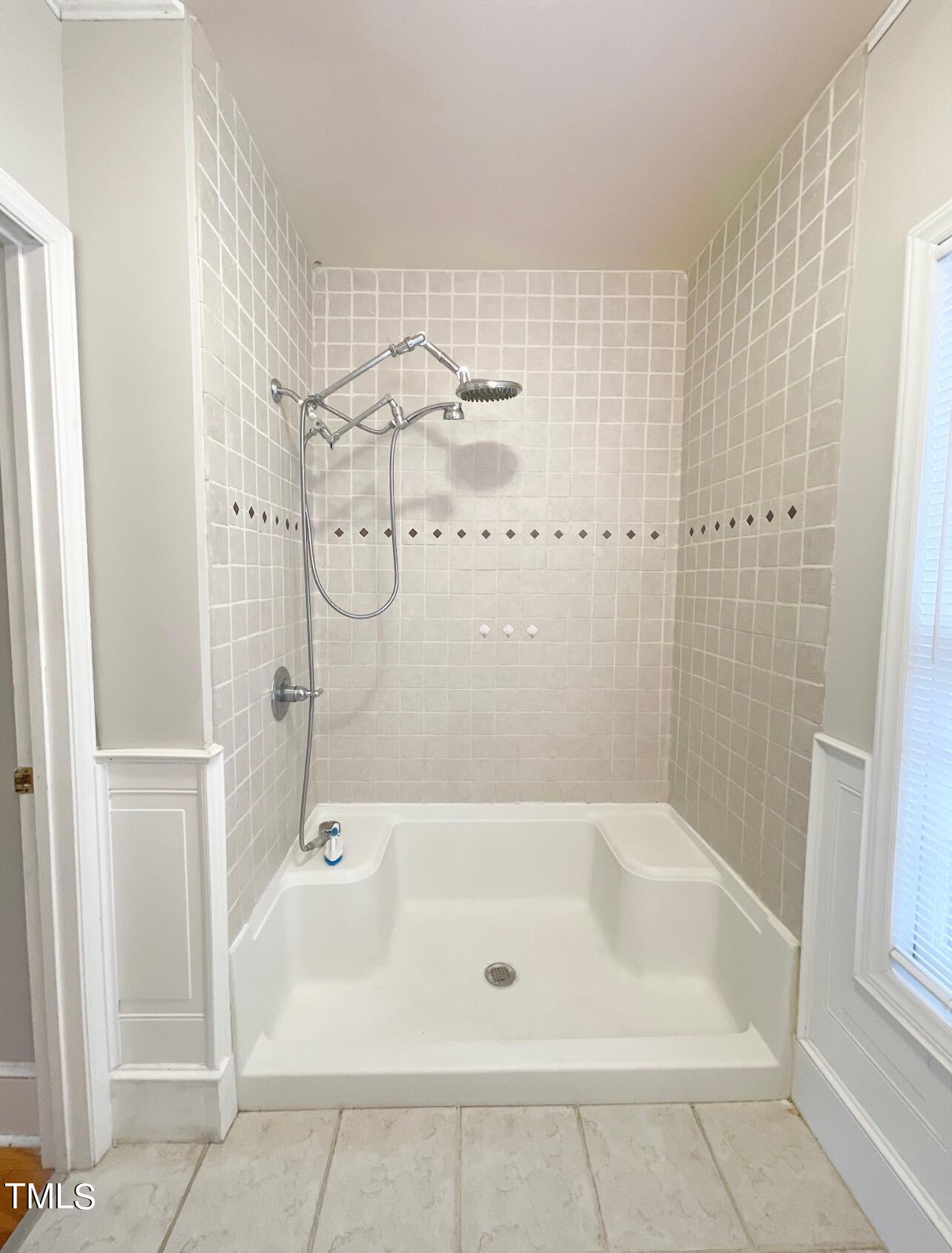 237 Wesleyan Heights Road Roxboro, NC 27573 - Photo 20 of 39 a bathroom with a bathtub and shower
