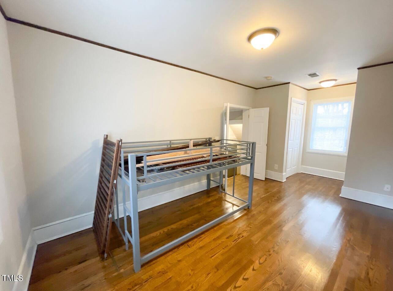 237 Wesleyan Heights Road Roxboro, NC 27573 - Photo 22 of 39 a kitchen view with wooden floor and a window