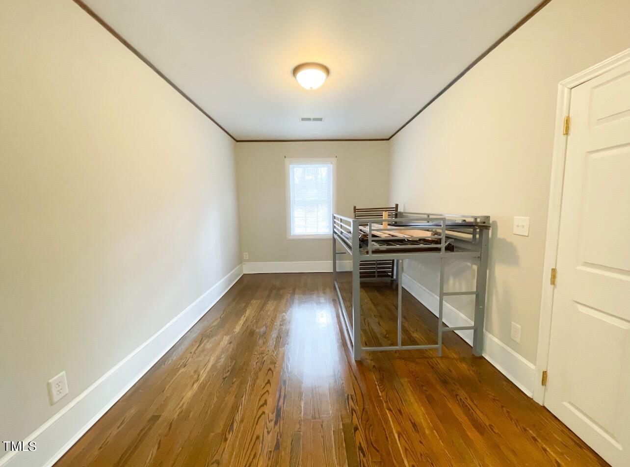 237 Wesleyan Heights Road Roxboro, NC 27573 - Photo 23 of 39 a view of a workspace with furniture and wooden floor