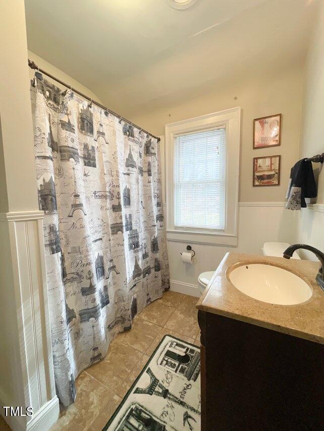 237 Wesleyan Heights Road Roxboro, NC 27573 - Photo 28 of 39 a bathroom with a granite countertop sink and a mirror