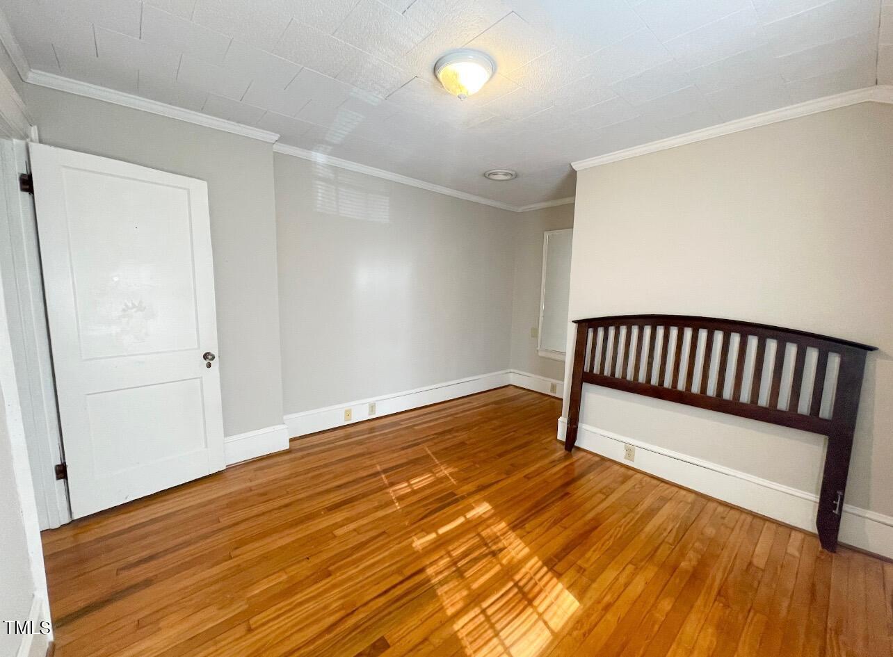 237 Wesleyan Heights Road Roxboro, NC 27573 - Photo 29 of 39 a view of a room with wooden floor