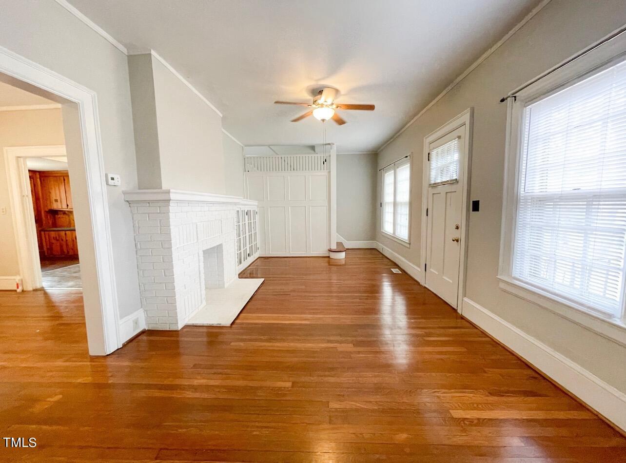 237 Wesleyan Heights Road Roxboro, NC 27573 - Photo 3 of 39 wooden floor in an empty room with a window