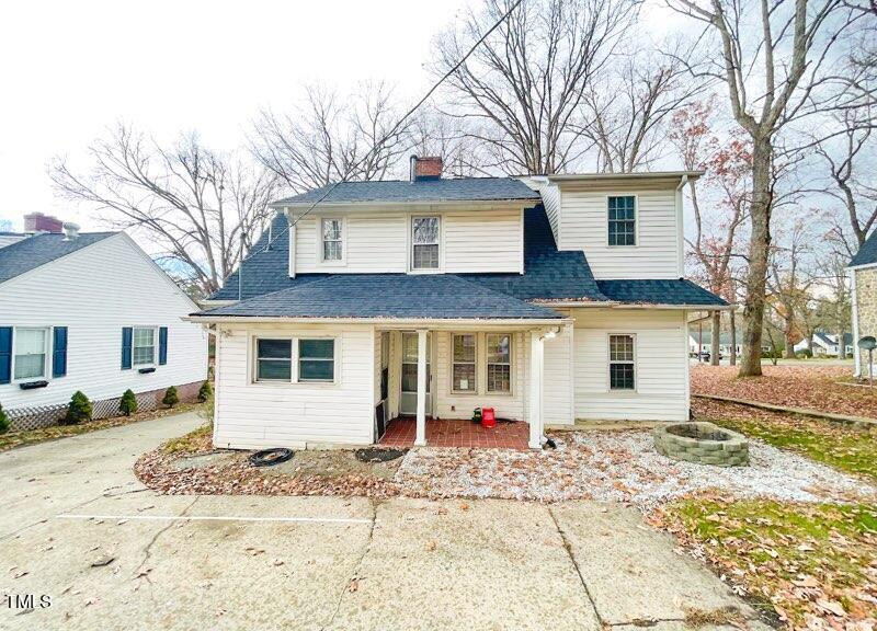 237 Wesleyan Heights Road Roxboro, NC 27573 - Photo 32 of 39 a front view of a house with a yard
