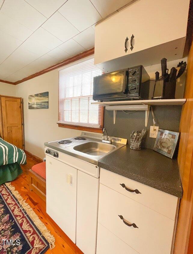 237 Wesleyan Heights Road Roxboro, NC 27573 - Photo 37 of 39 a kitchen with a sink and a stove top oven