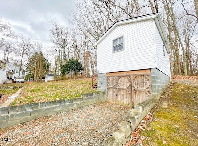 237 Wesleyan Heights Road Roxboro, NC 27573 - Photo 39 of 39 a view of parking space with snow on the road