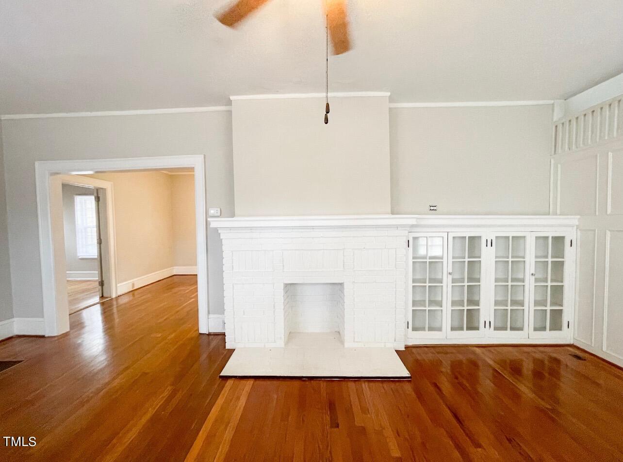 237 Wesleyan Heights Road Roxboro, NC 27573 - Photo 4 of 39 a view of an empty room with wooden floor and a window