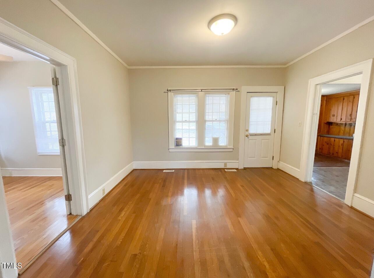 237 Wesleyan Heights Road Roxboro, NC 27573 - Photo 8 of 39 wooden floor in an empty room with a window