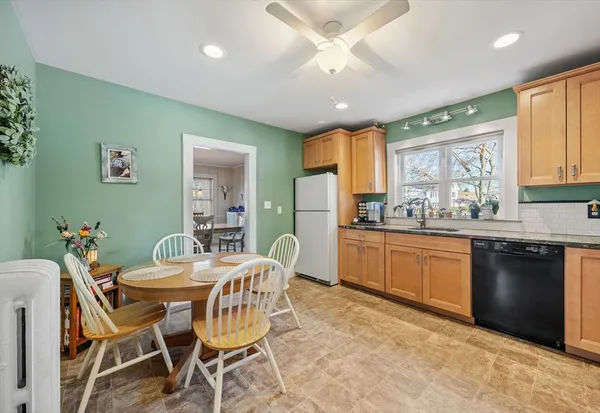 a view of a dining room with furniture window and outside view