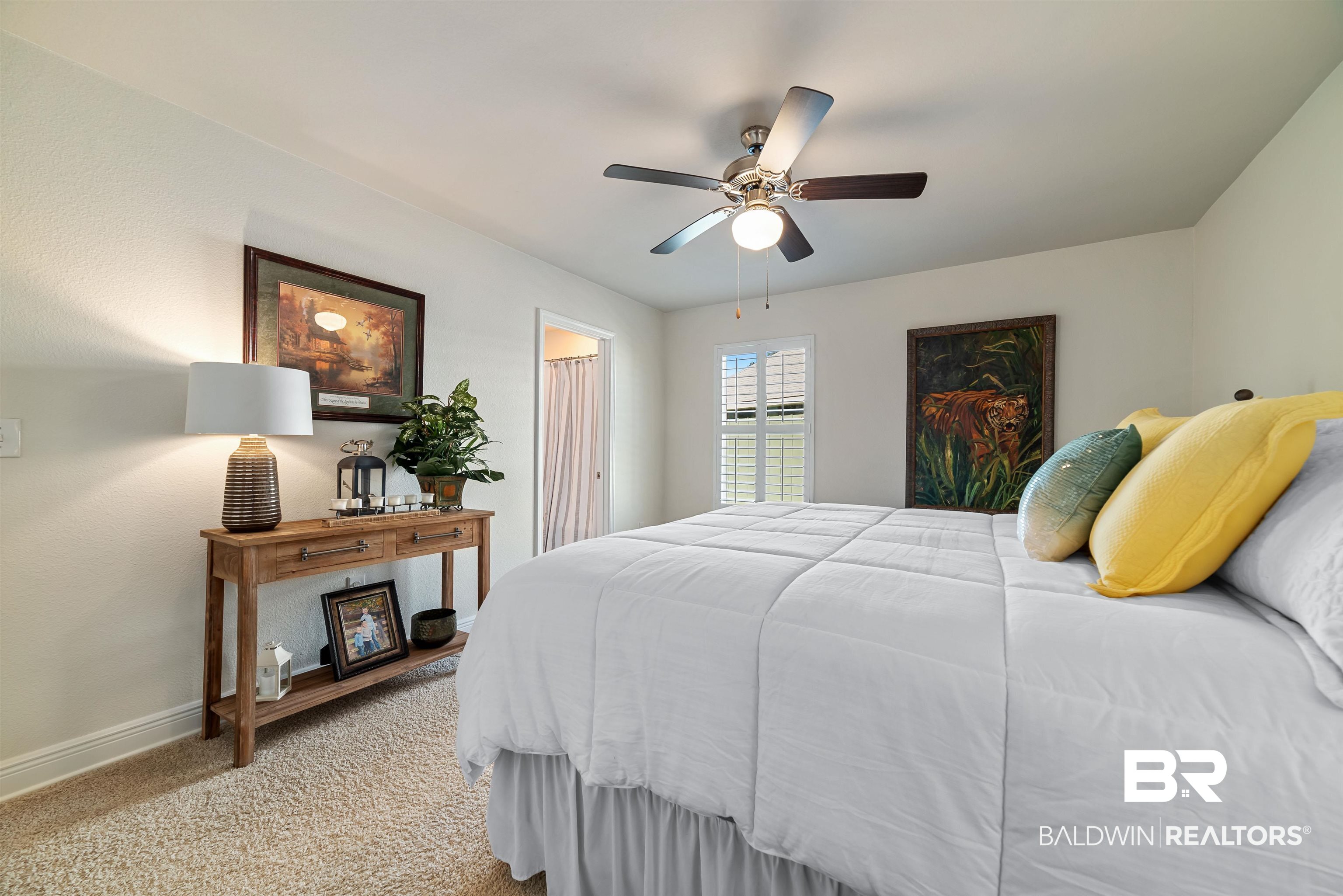 1290 Mako Loop Gulf Shores, AL 36542 - Photo 32 of 50 Bedroom with baseboards, a ceiling fan, and light colored carpet