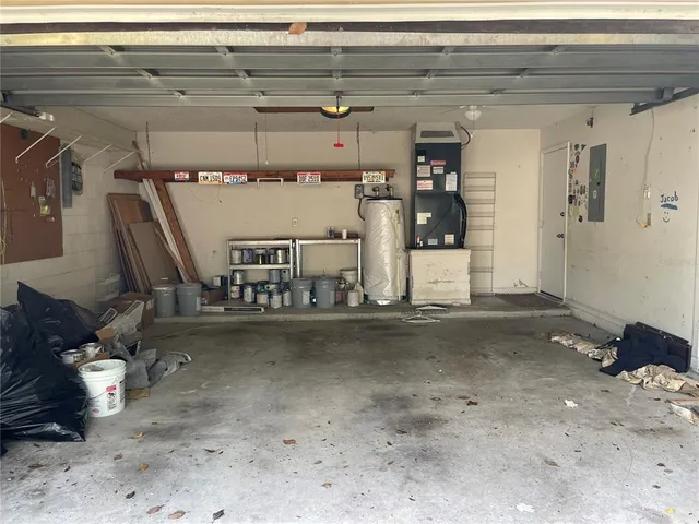 a view of a livingroom with a floor to ceiling window and floor to ceiling window