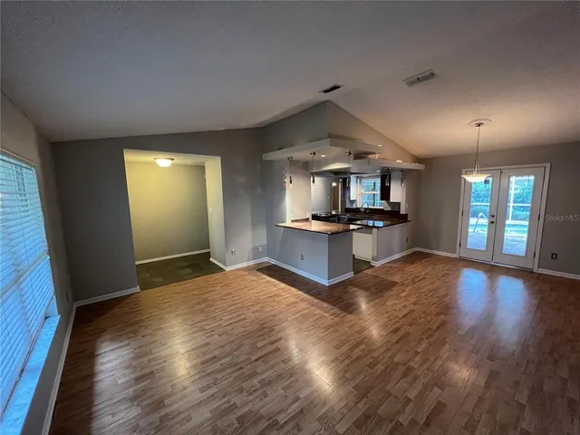 a view of a kitchen with a sink and a stove top oven