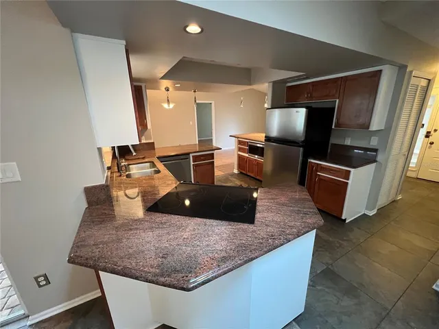 a kitchen with kitchen island counter top space
