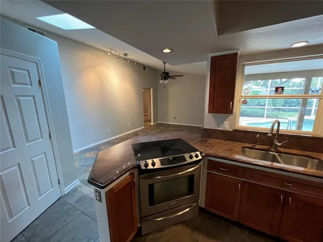 a kitchen with a stove and a sink