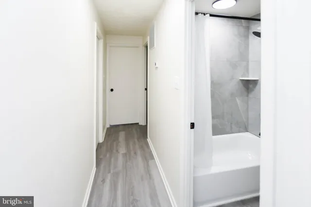 a view of a bathroom from a hallway