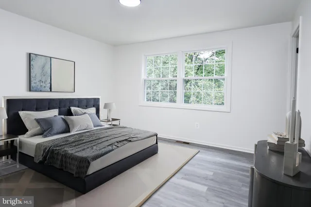 a bedroom with a bed and window